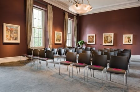 Orpen Boardroom at IWM London, modern chairs arranged for presentations and workshops.